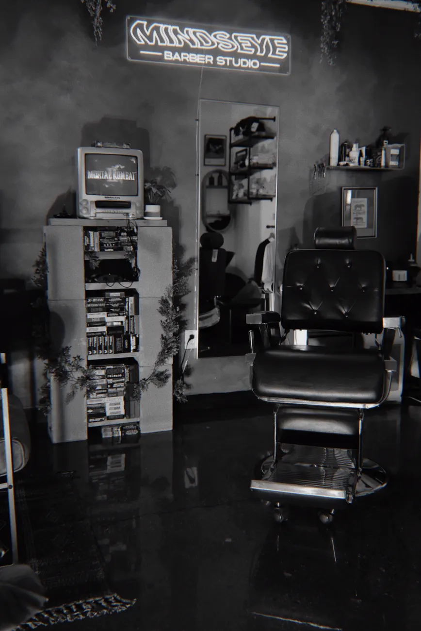 The chair, the VHS shelf and the Minds Eye neon sign